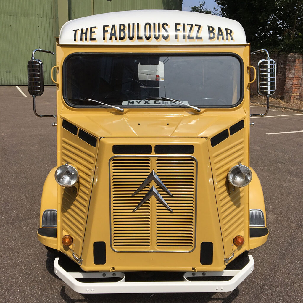 Hand-painted lettering on the front of a classic Citroën H Van for The Fabulous Fizz Bar, adding a clean vintage feel to this beautifully restored vehicle.