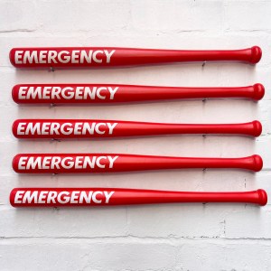 Red Emergency bat with white hand painted lettering displayed on wall. Would make the perfect unusual gift for someone.