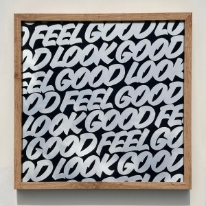Gilded glass Look Good Feel Good artwork displayed in a wooden frame. The perfect objet d'art for design-led interiors